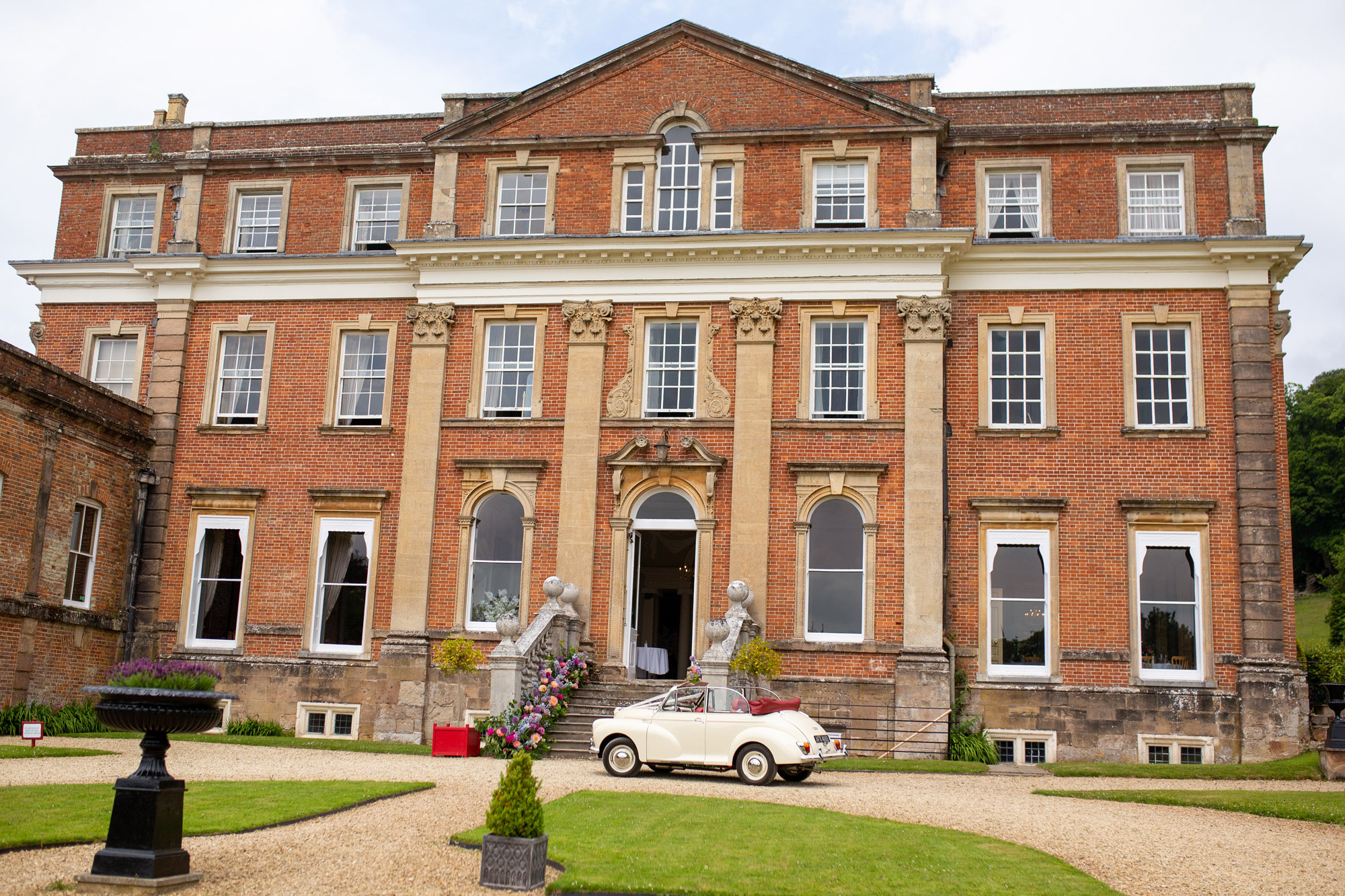 A gloriously colourful and fun wedding at Crowcombe Court with stunning florals, images by Somerset photographer Martin Dabek