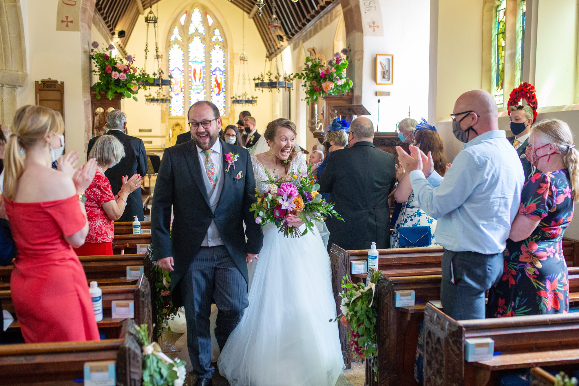 A gloriously colourful and fun wedding at Crowcombe Court with stunning florals, images by Somerset photographer Martin Dabek