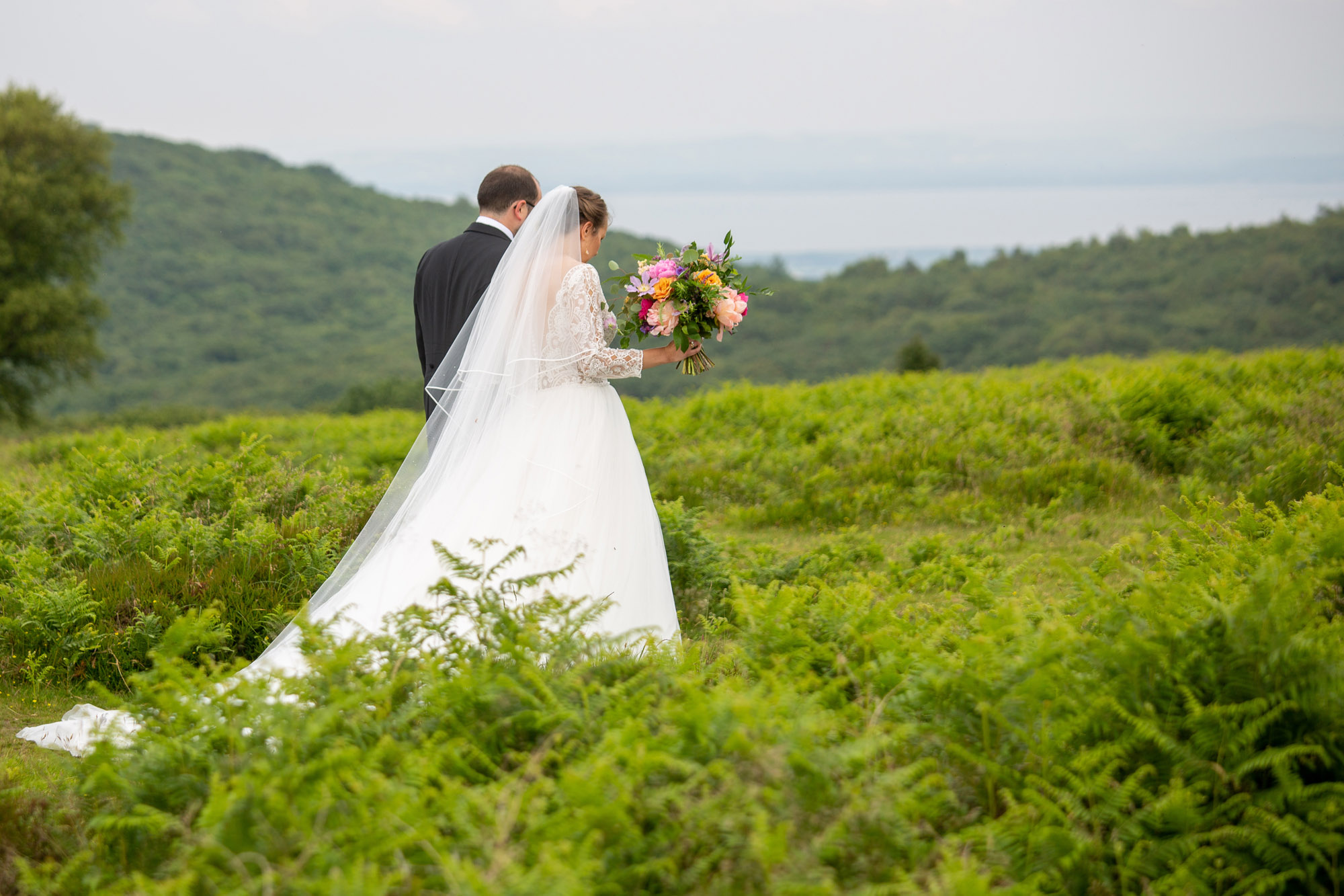 A gloriously colourful and fun wedding at Crowcombe Court with stunning florals, images by Somerset photographer Martin Dabek